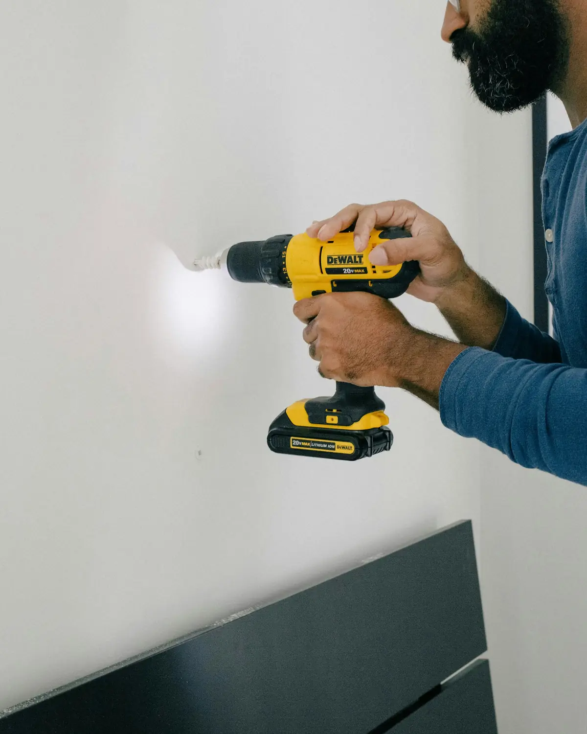 Cordless drill against a wall